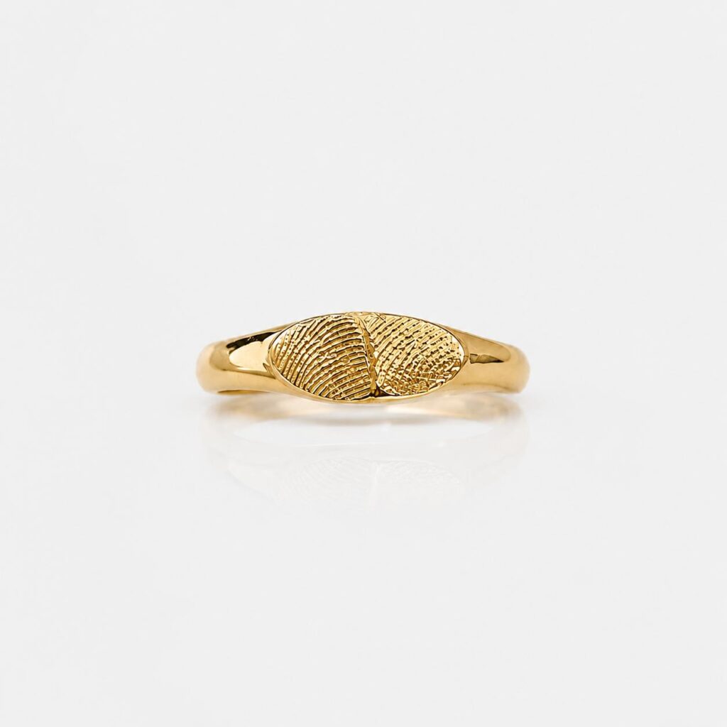 Oval signet ring with two fingerprints
